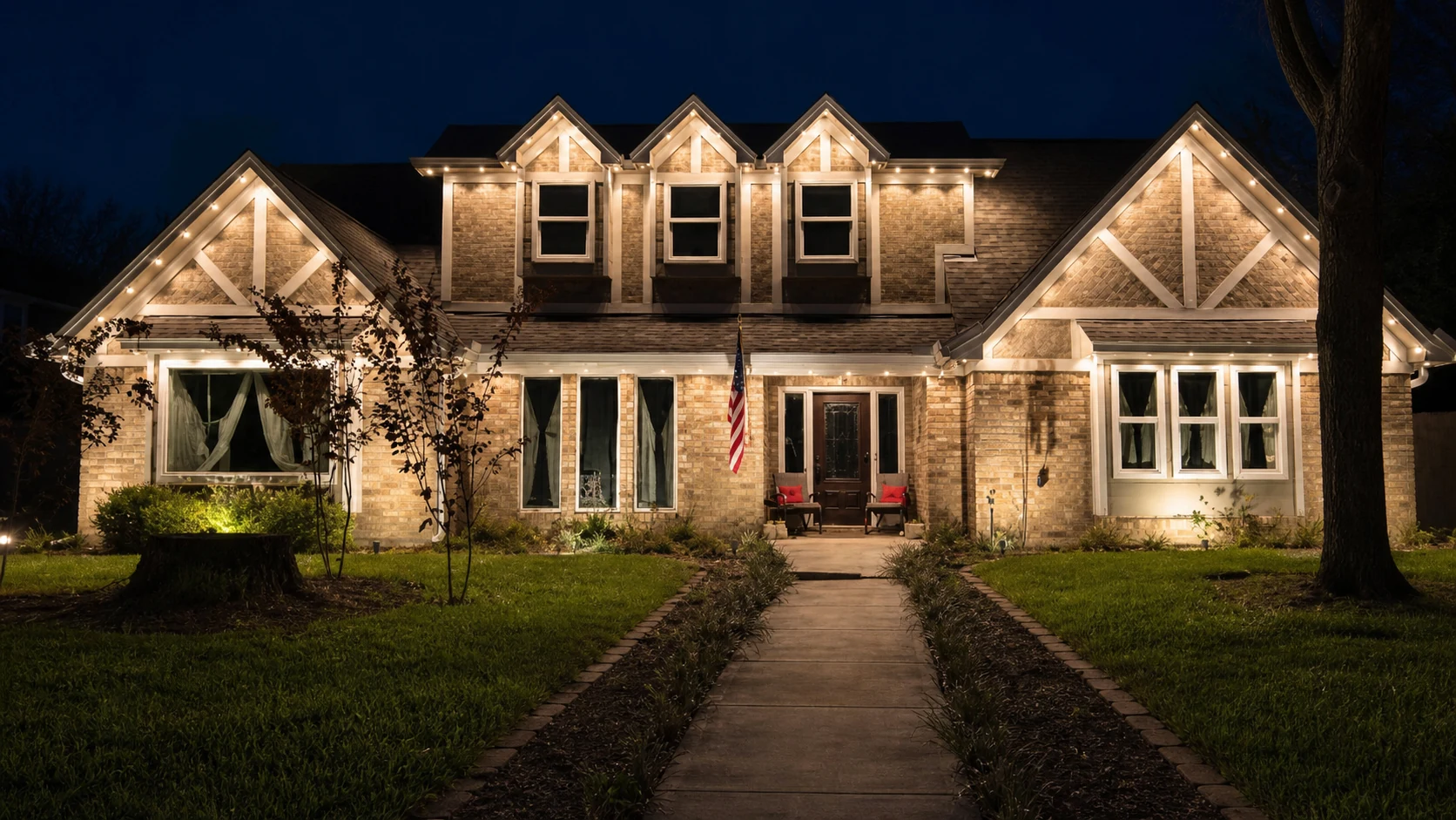 Real Skyclear install — permanent roofline lighting shown in an elegant warm-white color setting at night